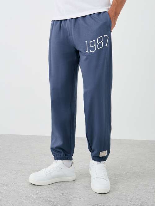 men typographic mid rise relaxed fit jogger - 21971572 - Standard Image - 0