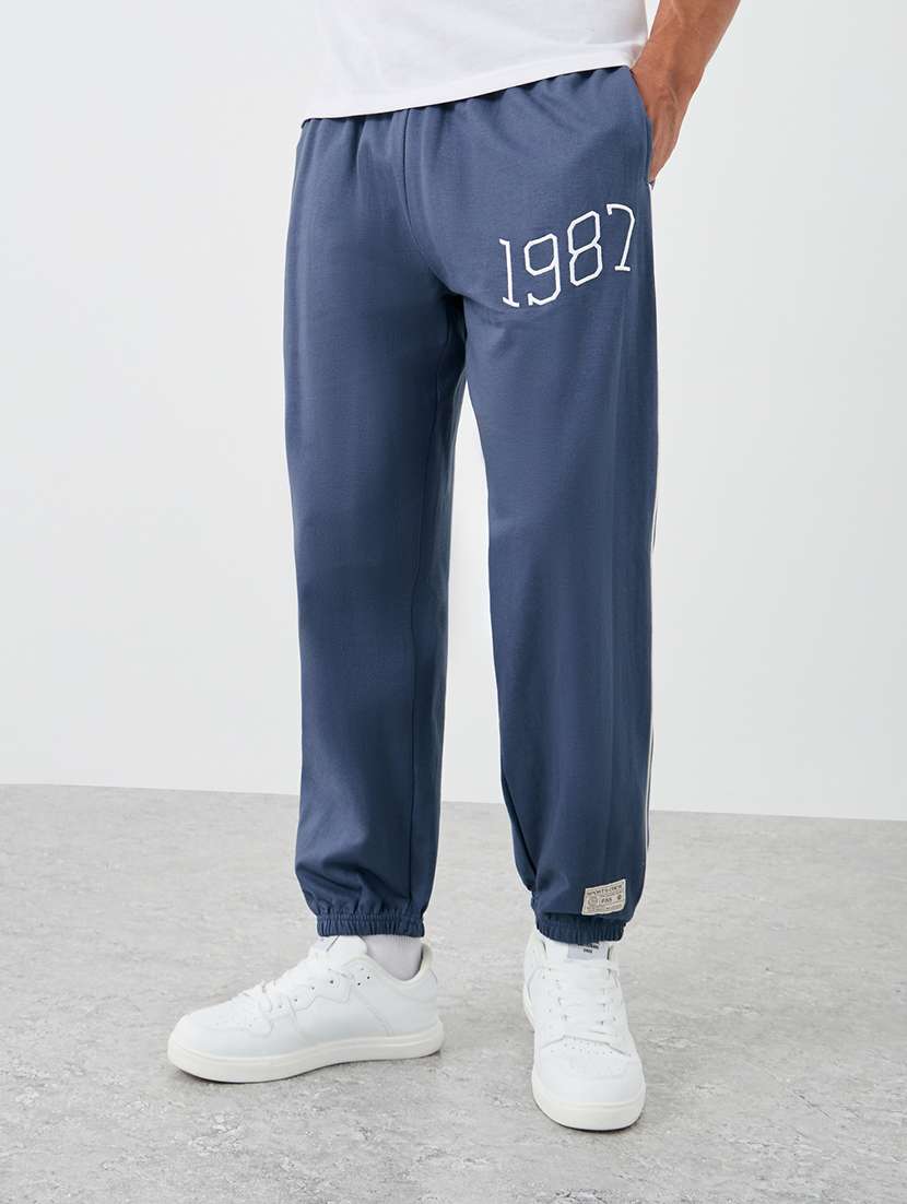 men typographic mid rise relaxed fit jogger - 21971572 - Zoom Image - 0