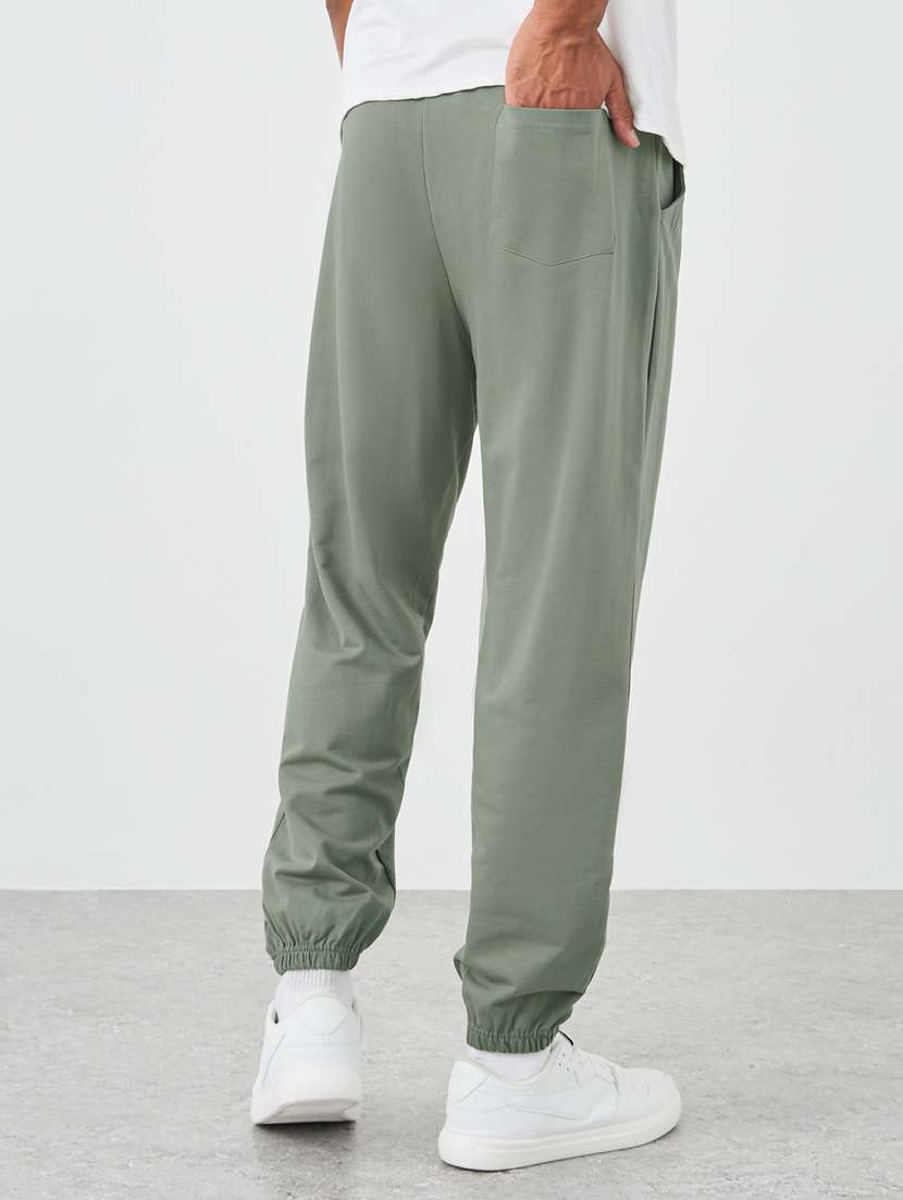 men placement print mid rise relaxed fit jogger - 21971580 -  Standard Image - 2