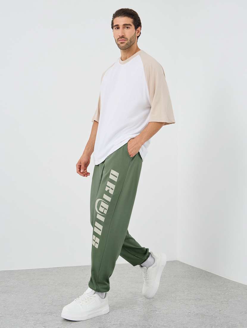 men typographic mid rise loose fit jogger - 21971630 -  Standard Image - 2