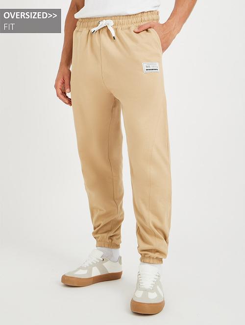 men solid mid rise relaxed fit jogger - 21971748 -  Standard Image - 0