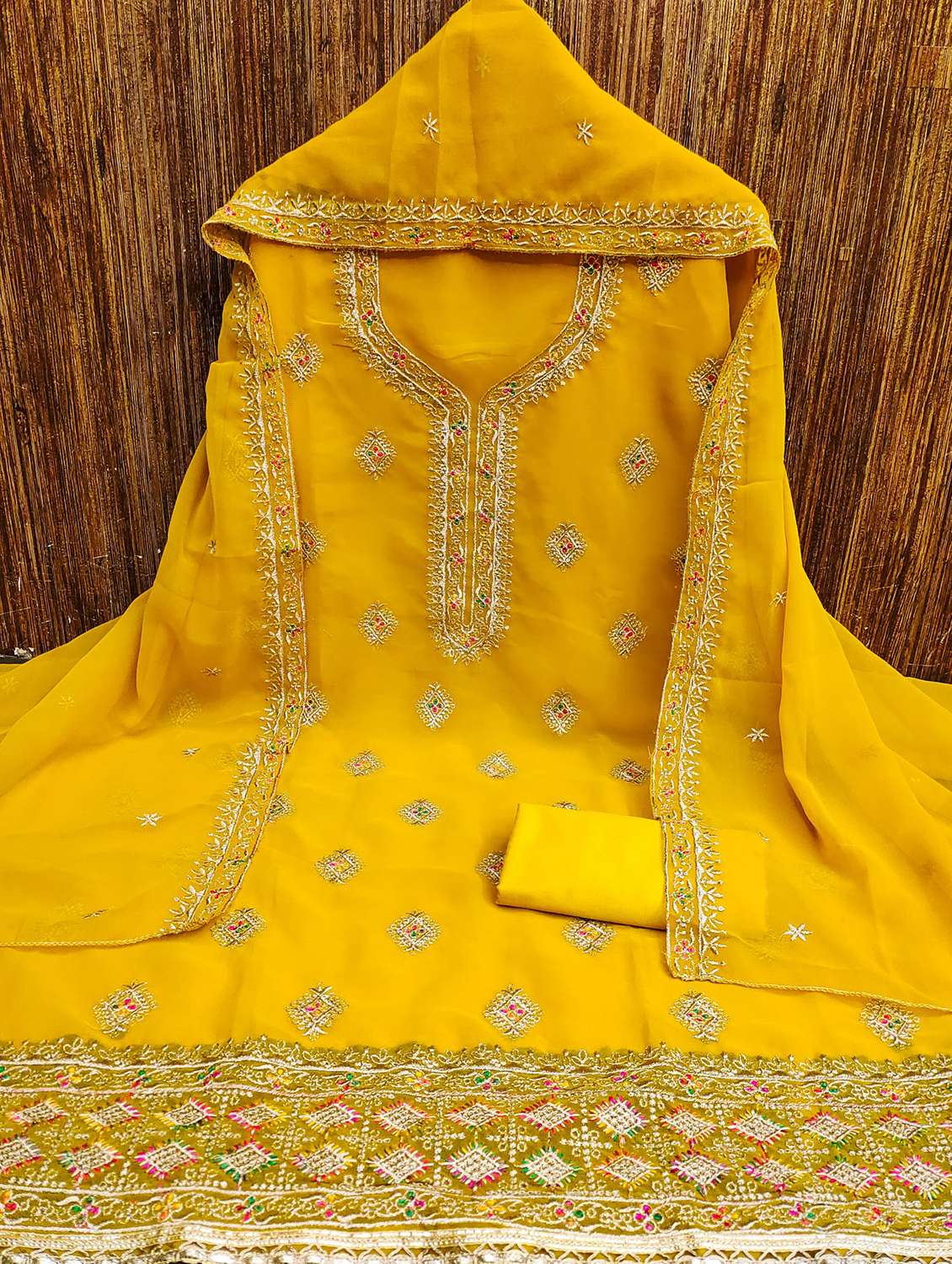 women solid with work embroidered unstitched suit set