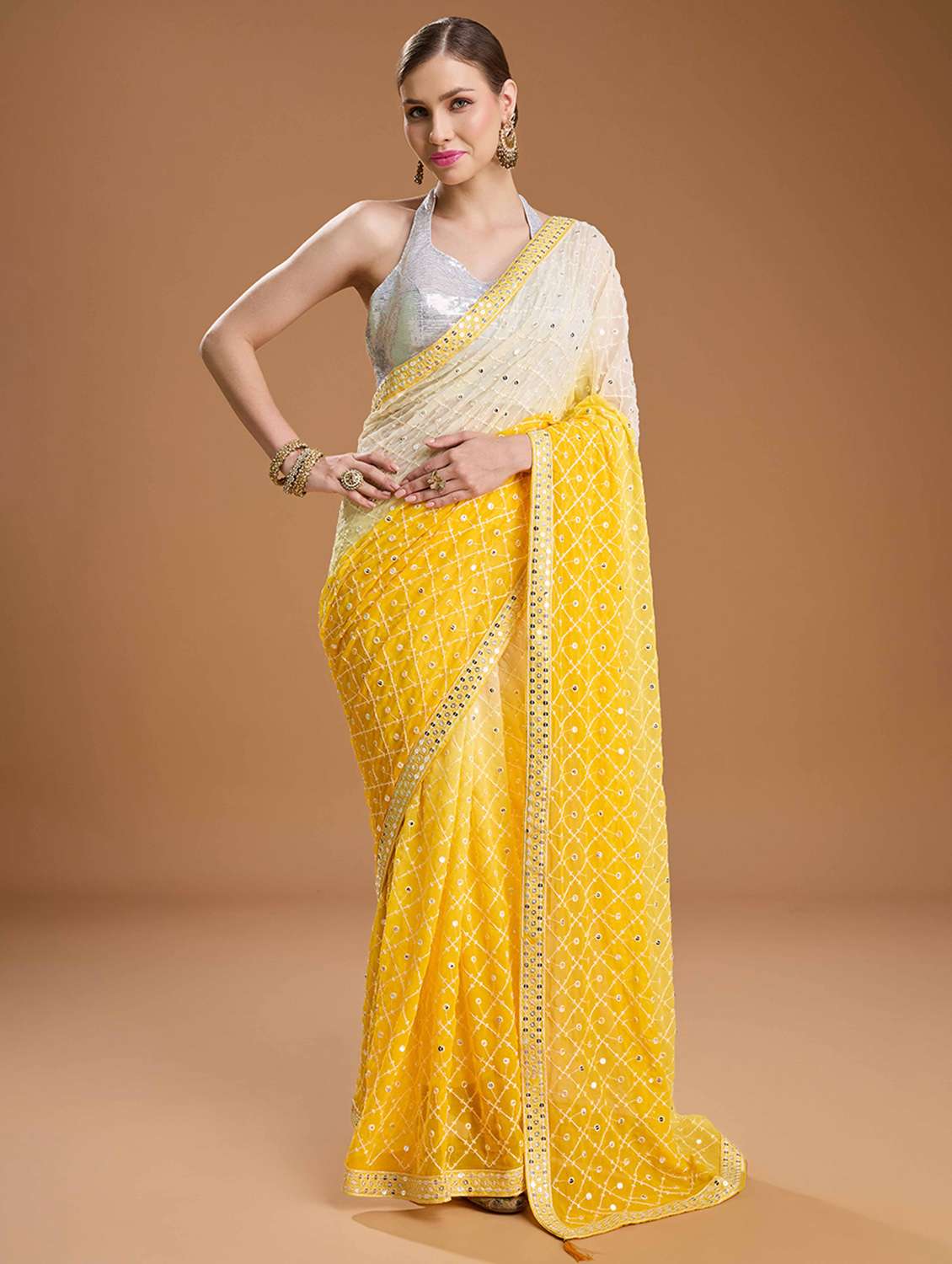 women yellow embroidered saree with blouse