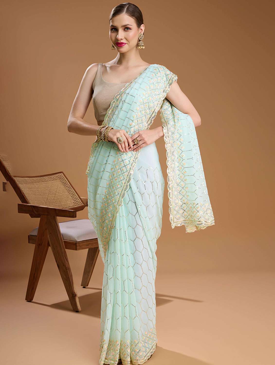 women solid with work embellished saree with blouse