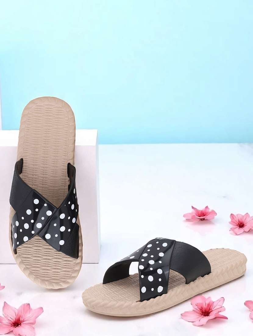 women black polka doted slides 