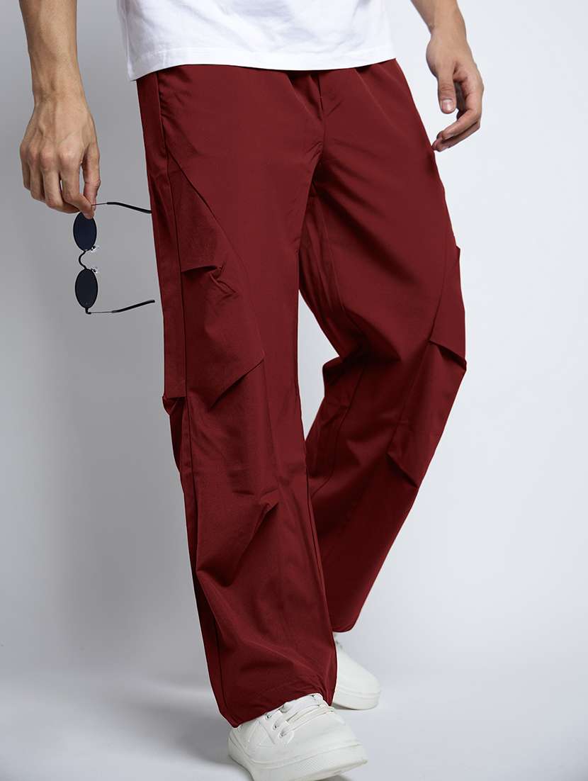 men solid mid rise loose fit parachute pants