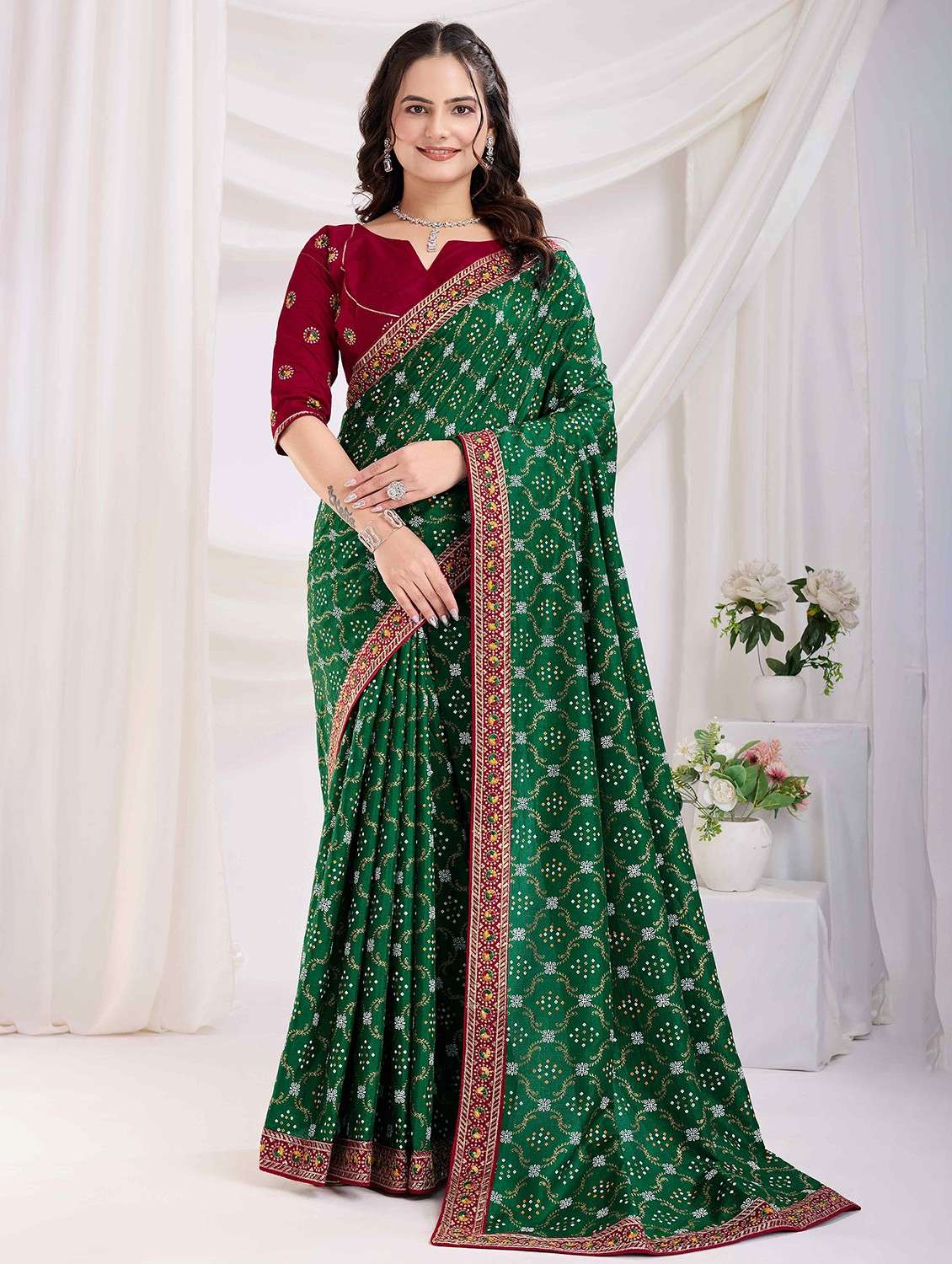 women bandhani printed bordered saree with blouse