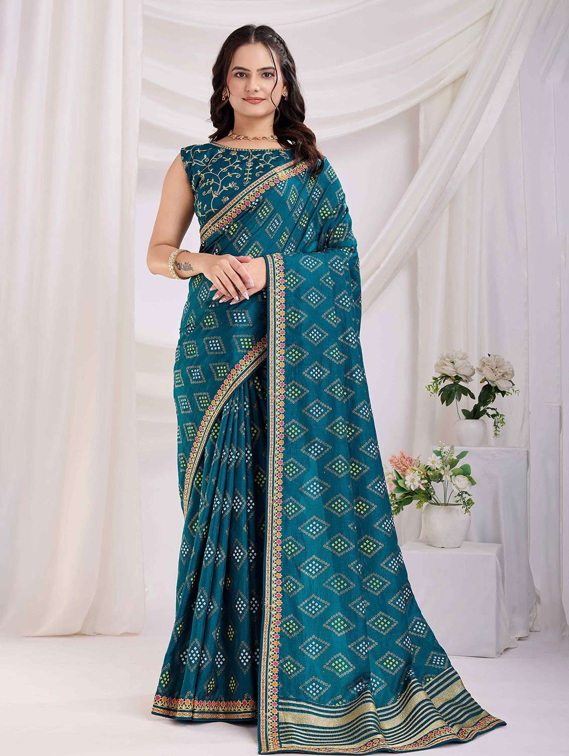 women bandhani printed bordered saree with blouse
