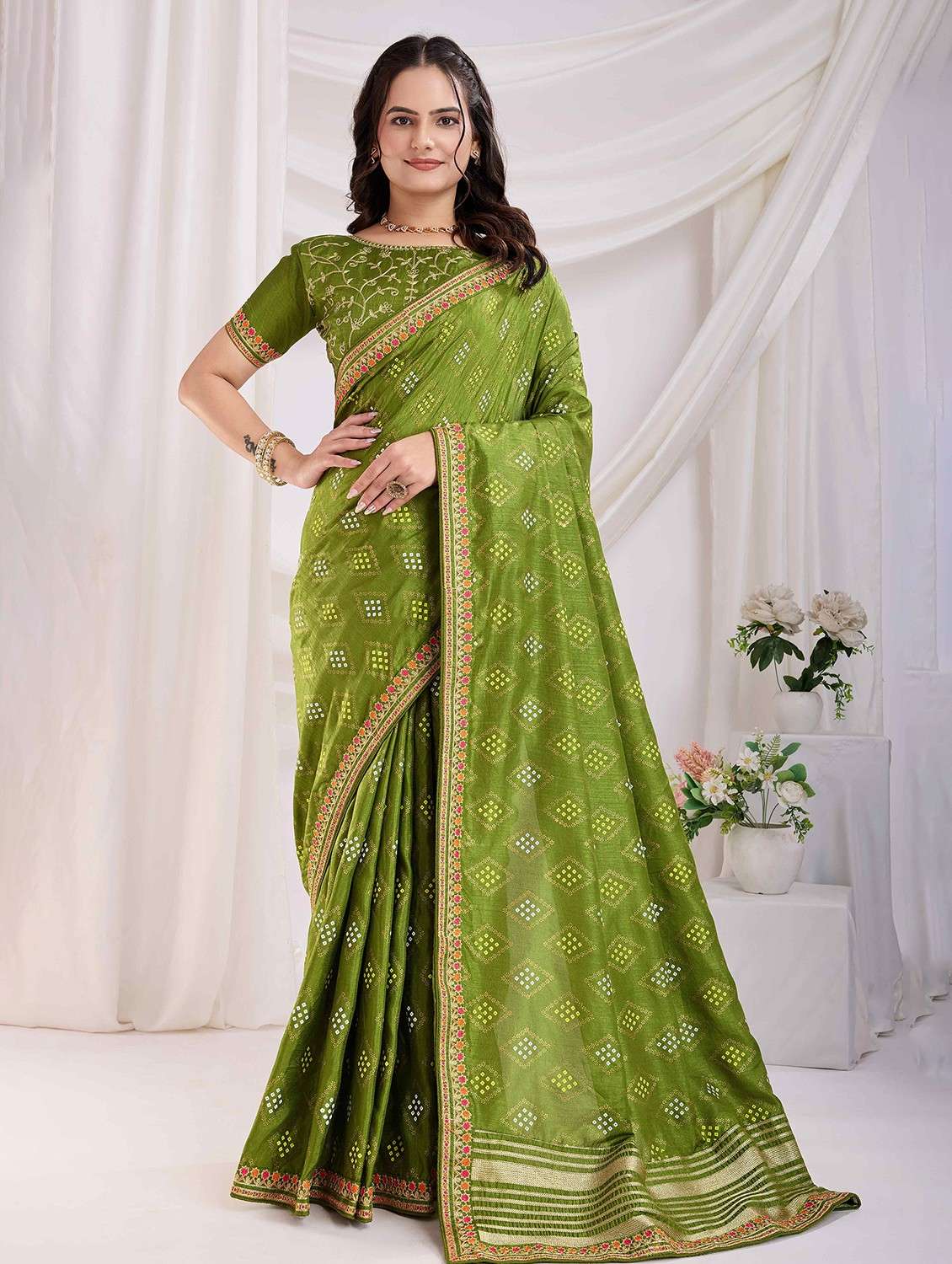 women bandhani printed bordered saree with blouse