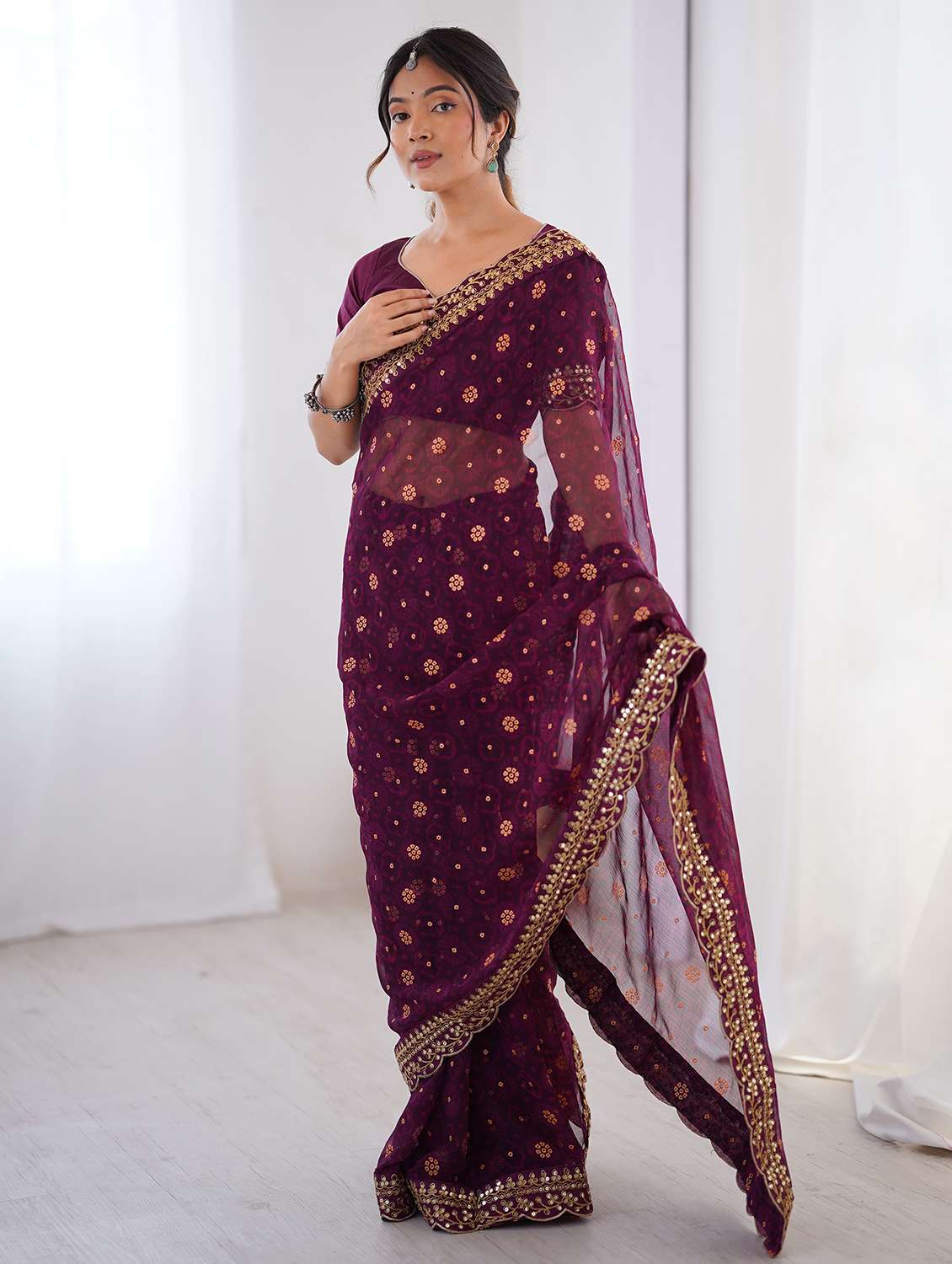 women bandhani printed bordered saree with blouse