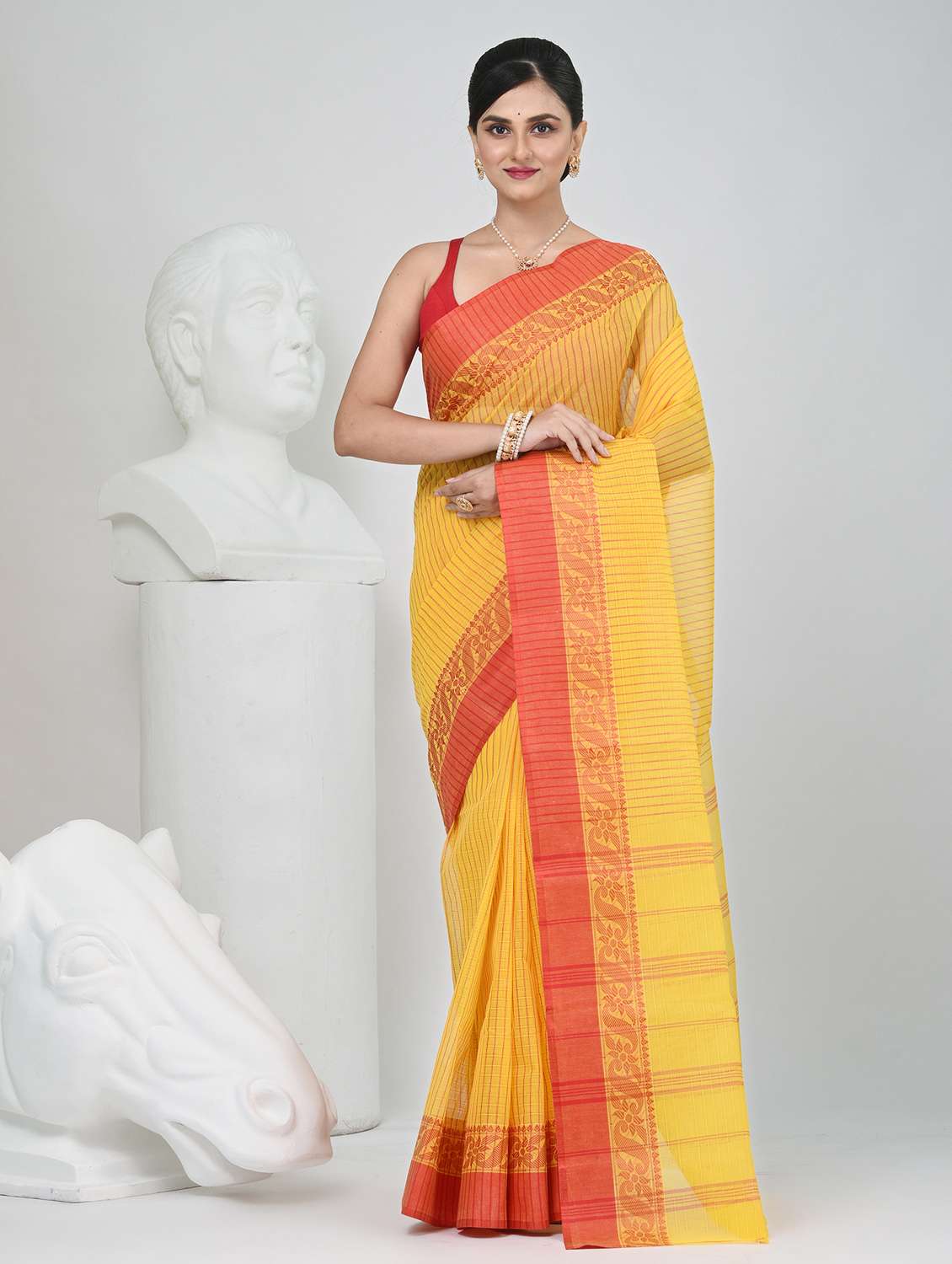 women striped tant saree