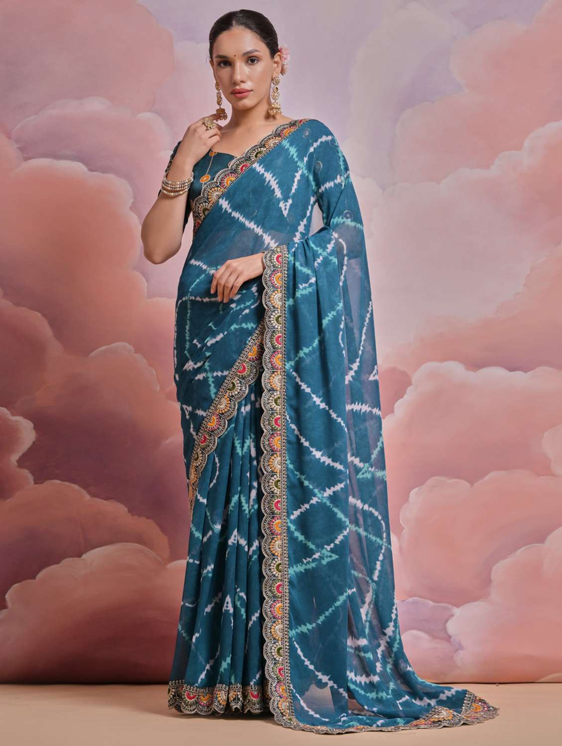 women tie & dye printed bordered saree with blouse