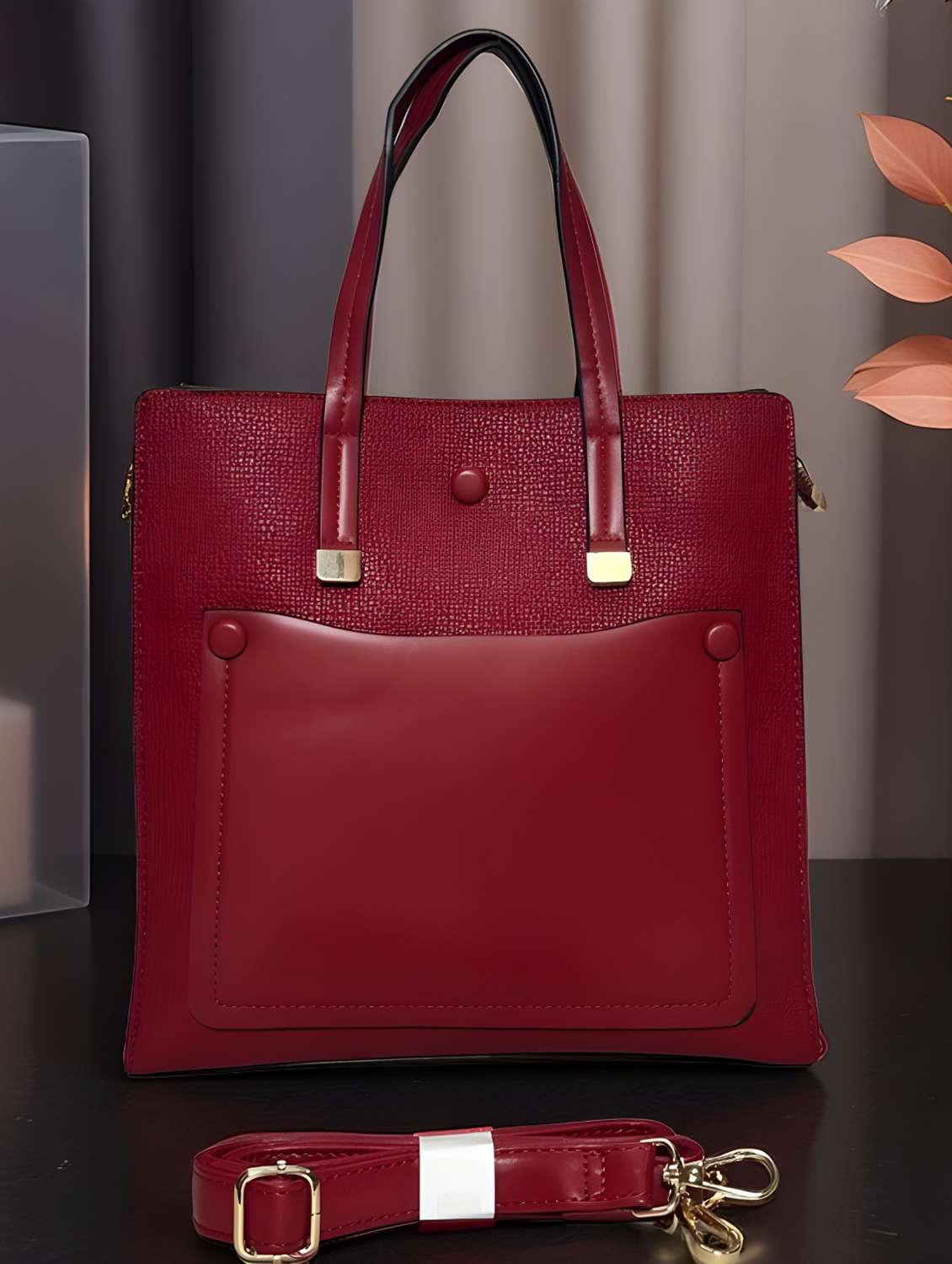 maroon textured handbag with detachable strap
