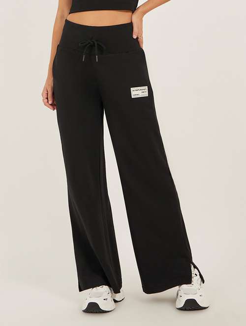 women solid mid rise relaxed fit track pant - 22083456 -  Standard Image - 0