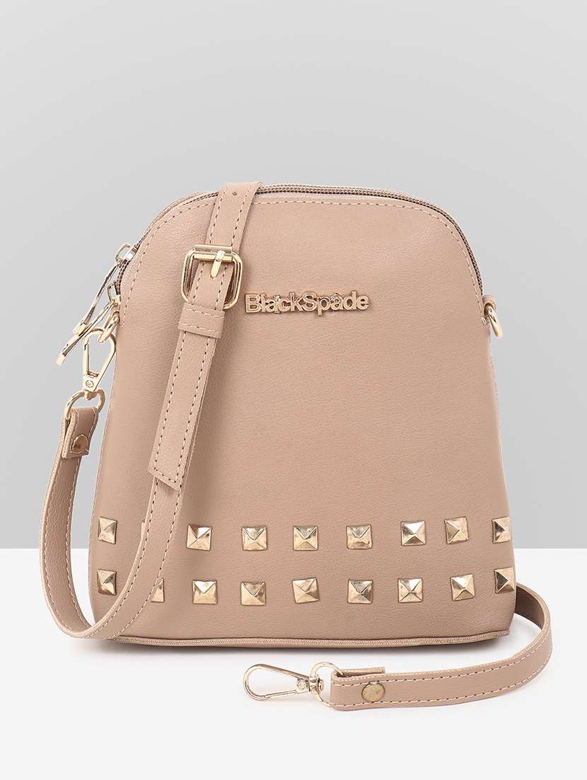 women beige leatherette sling bag