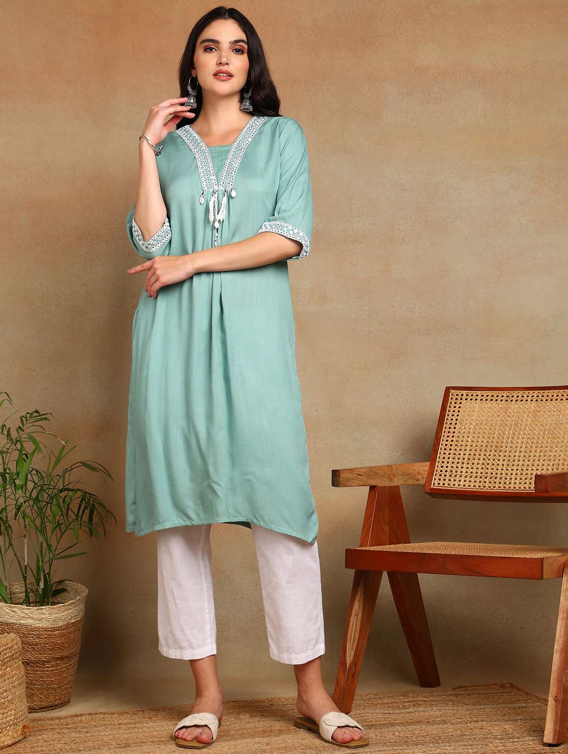 women solid with work three quarter sleeve a-line kurta