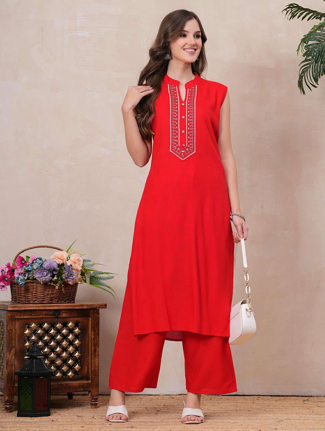 women embroidered sleeveless kurta palazzo set
