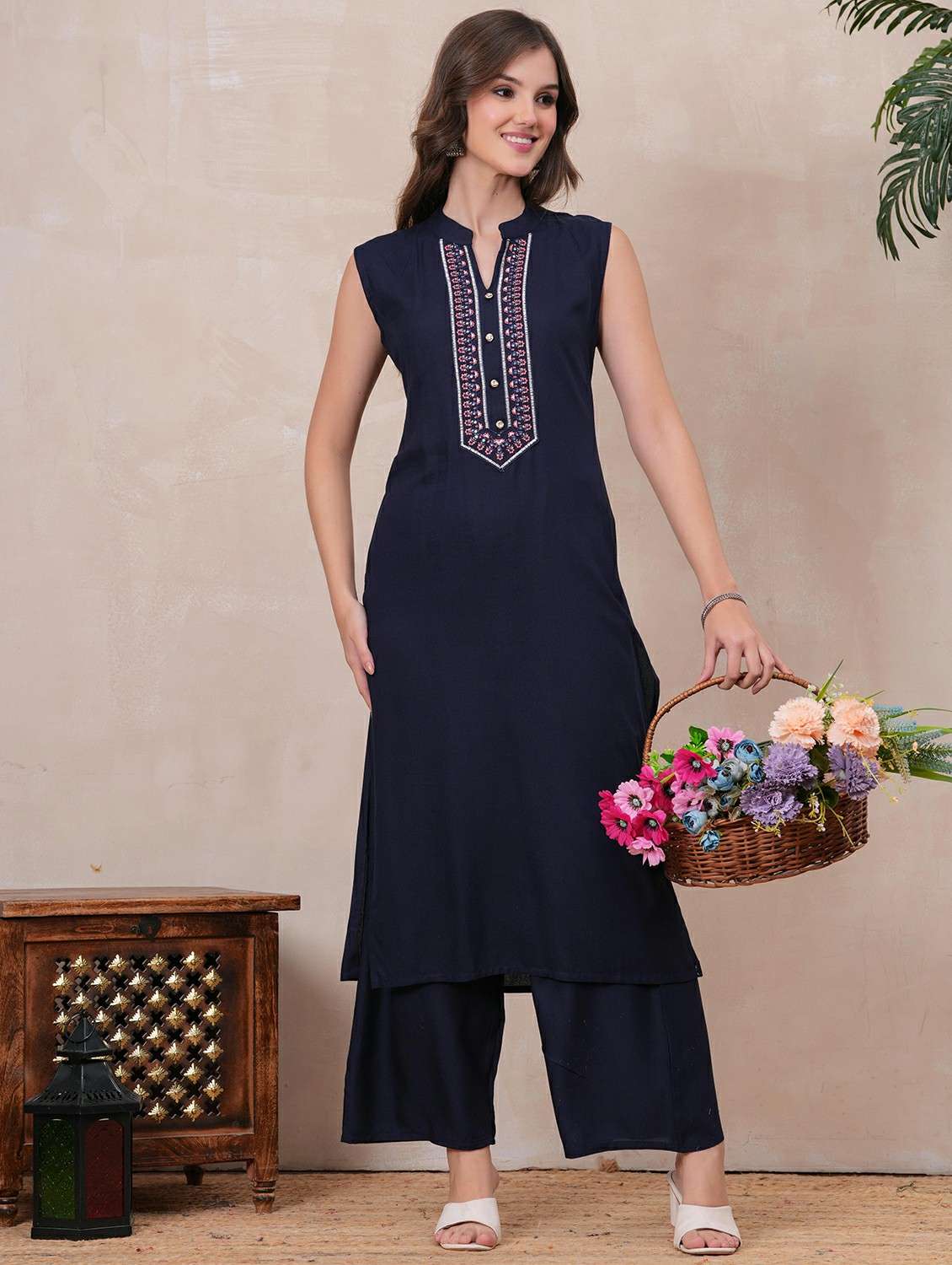 women embroidered sleeveless kurta palazzo set
