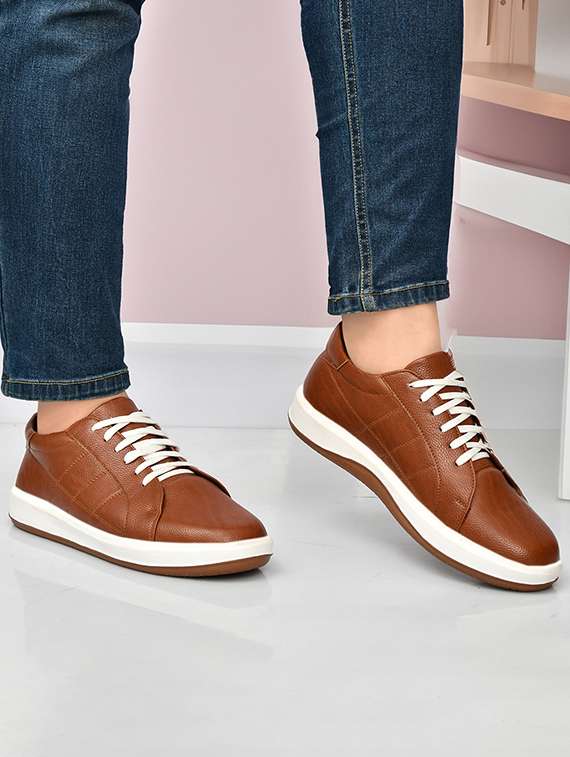 men tan lace-up shoe