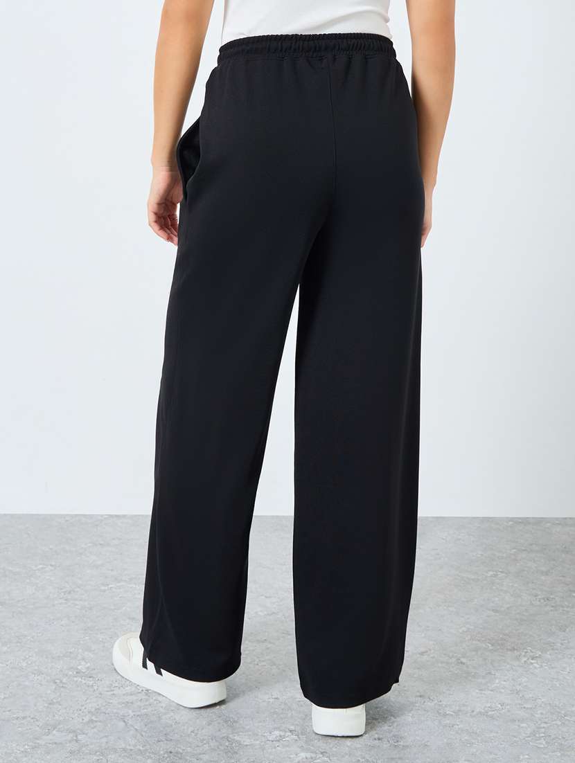 women solid high rise relaxed fit track pant - 22219919 -  Standard Image - 2