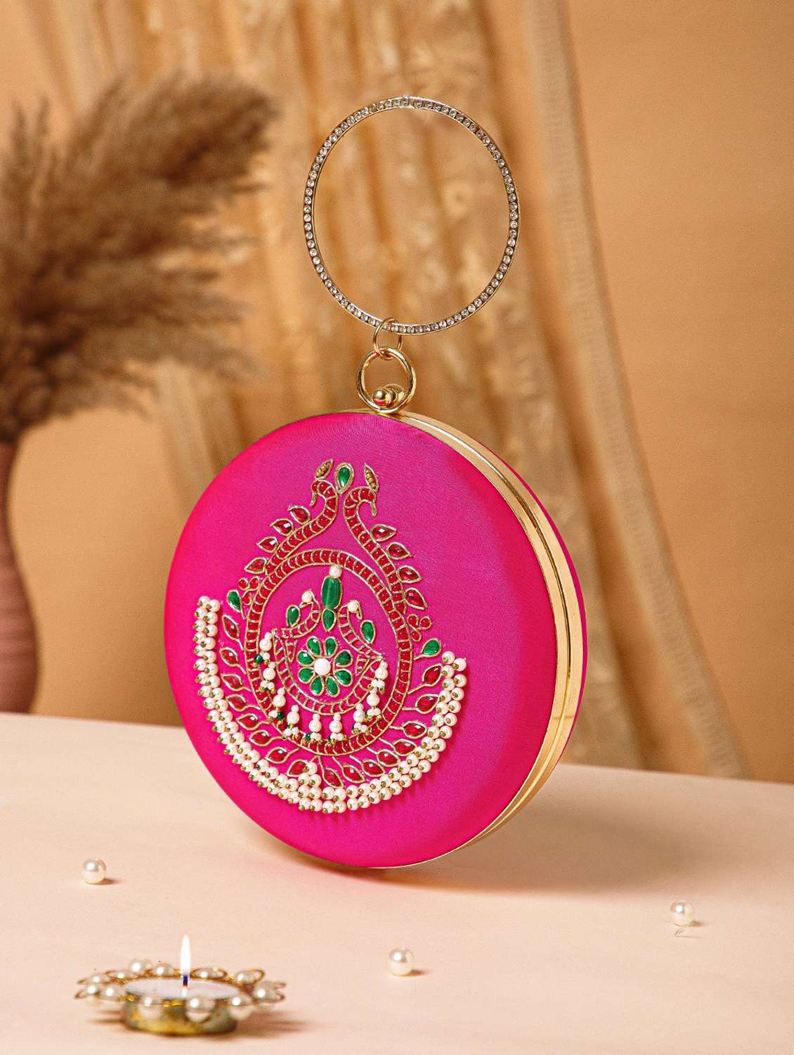 women magenta embellished clutch with sling strap