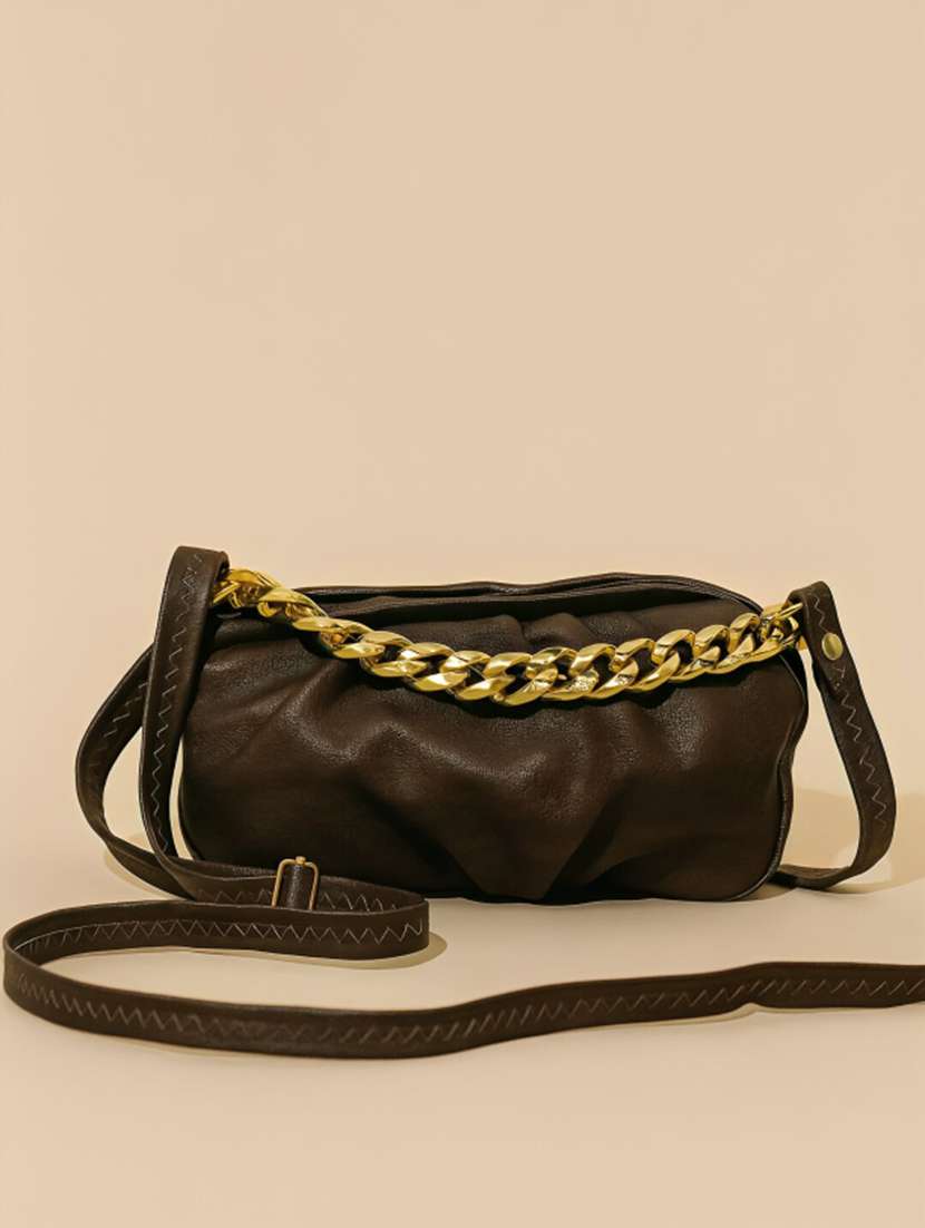 women brown chain design handbag