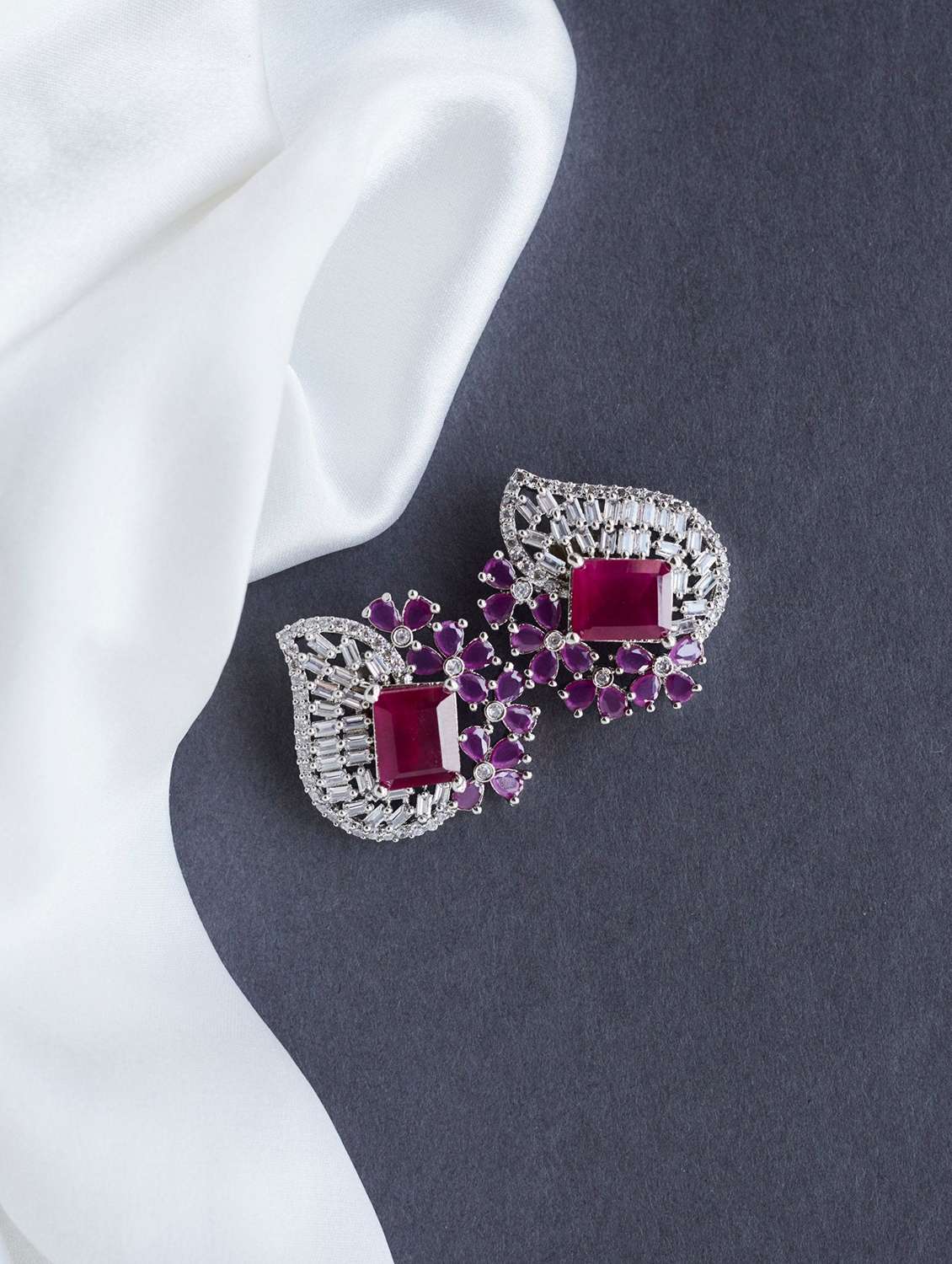 women stone studded stud earrings