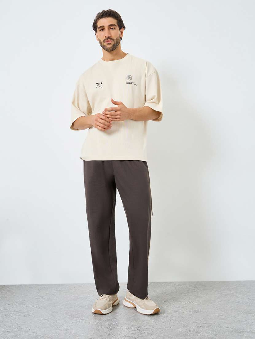 men solid mid rise relaxed fit track pant - 22287915 -  Standard Image - 2