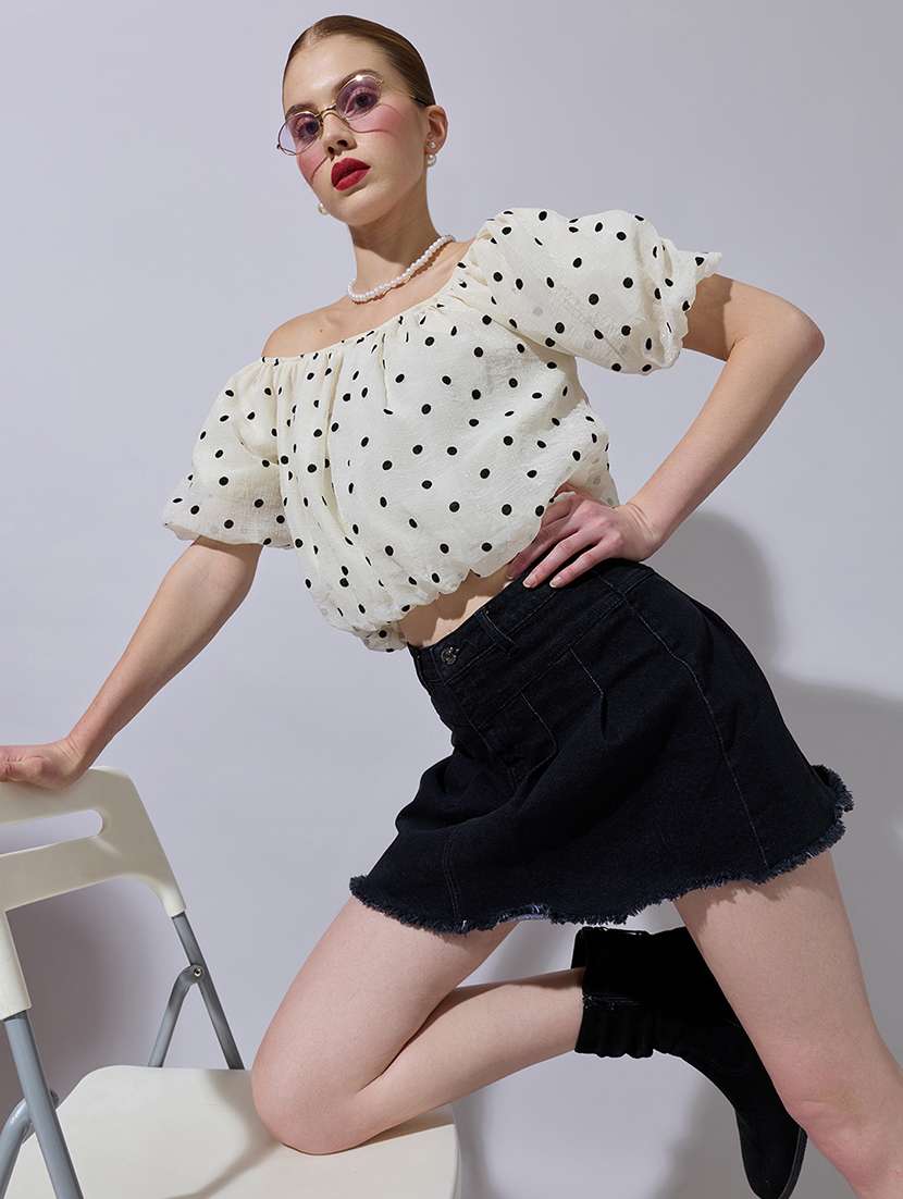 women polka doted off shoulder crop top