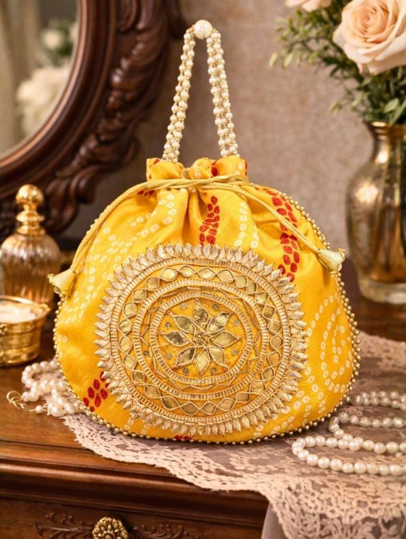 women embellsihed potli bag