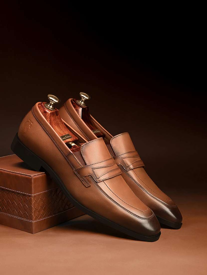 men tan slip on formal shoes