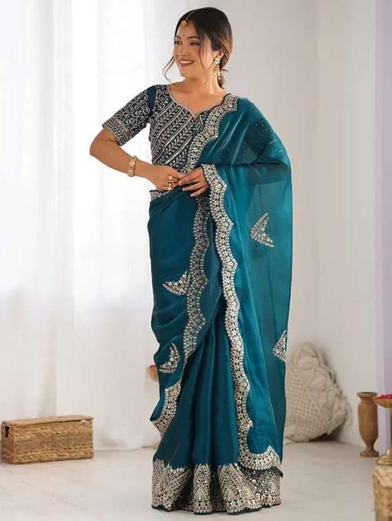women solid with work embroidered saree with blouse