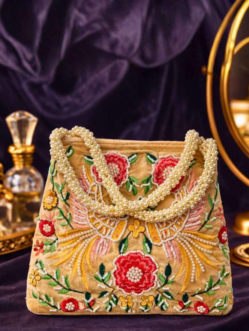 women solid with work embroidered potli
