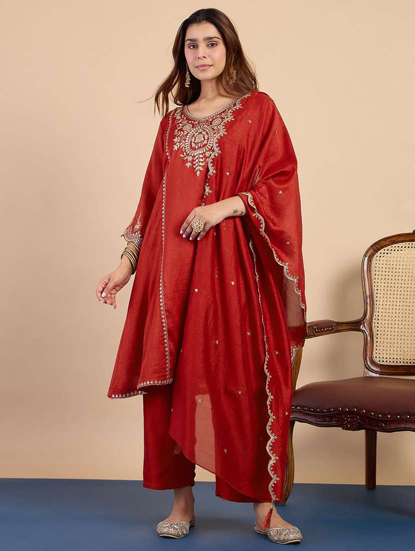 women orange kurta dupatta set