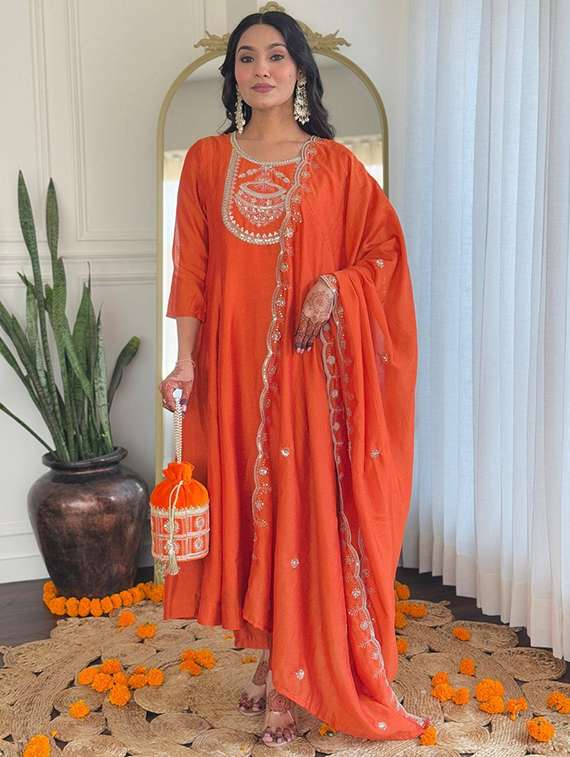 women orange kurta dupatta set