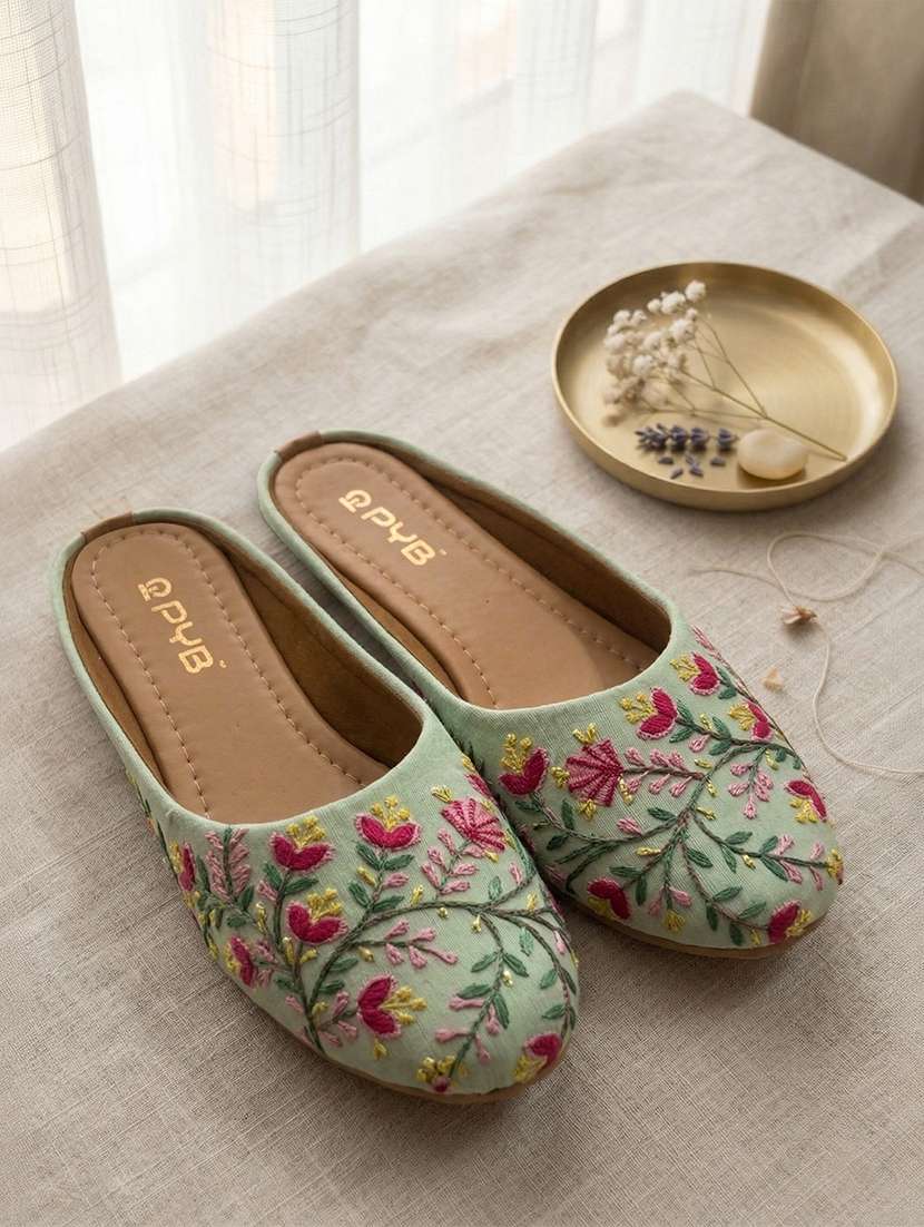 women teal slip on jutis & mojari