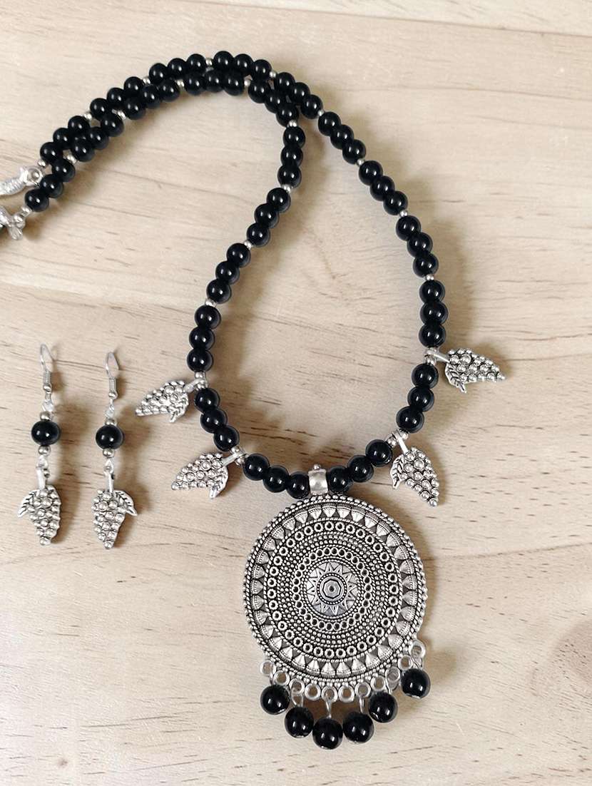 oxidized black metal pendant necklace and earrings set for women - 22489785 -  Standard Image - 2