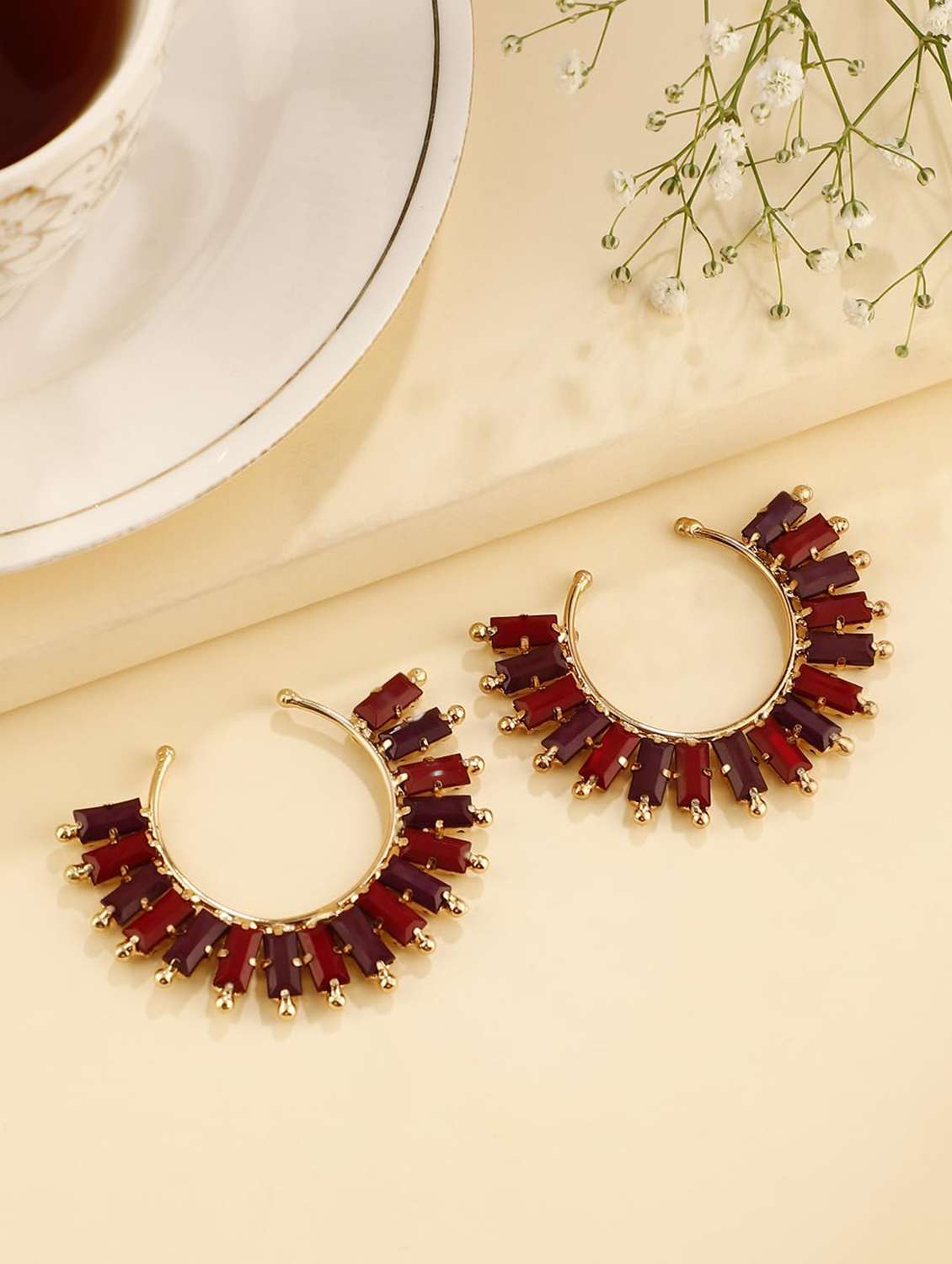 gold-toned metal beaded hoop earring