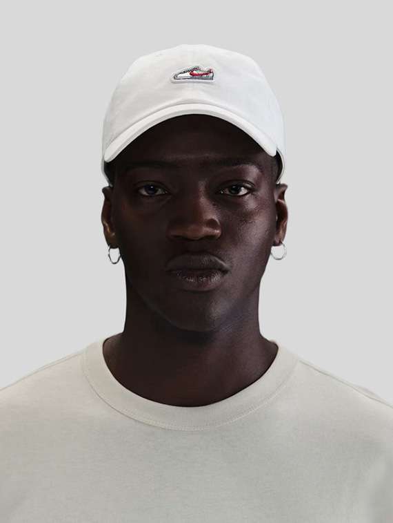 white cotton base ball cap with shoe patch - 22517909 -  Standard Image - 2