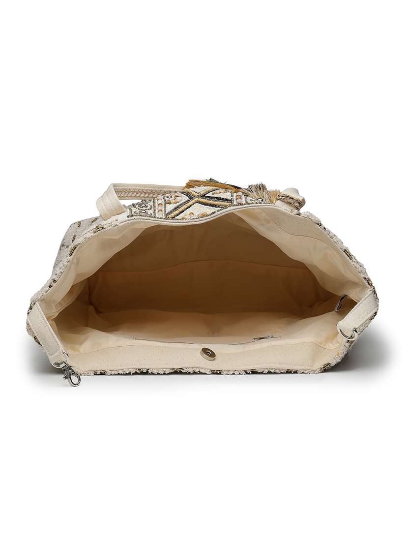 geometric pattern cotton canvas hobo bag with embellishment and button closure - 22541935 -  Standard Image - 2