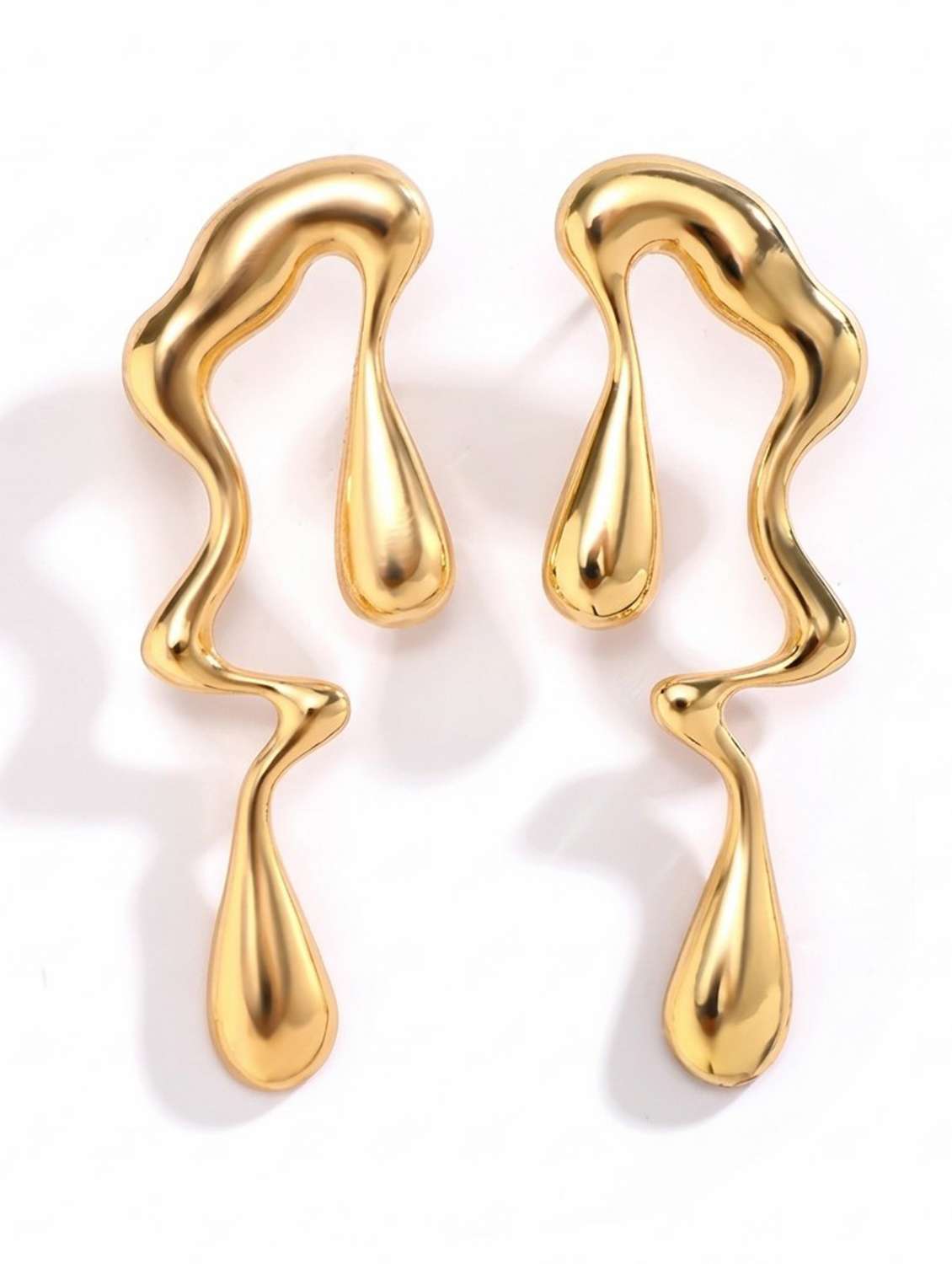 women gold drop earrings - 22569706 -  Standard Image - 2