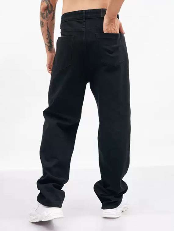 men slashed knee mid rise baggy jeans - 22575498 -  Standard Image - 2