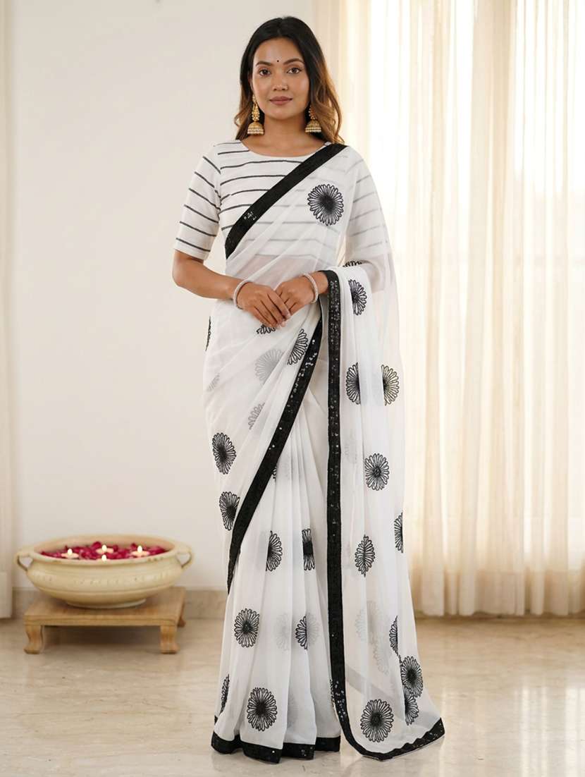 women solid with work embroidered saree with blouse