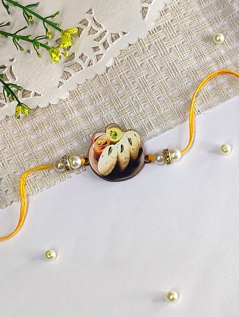 the magic wand trendy quirky idli wooden rakhi with pearls embelishement - 22598320 -  Standard Image - 2