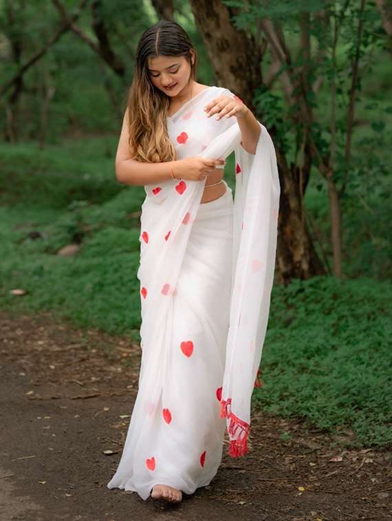 women solid with work embroidered saree with blouse