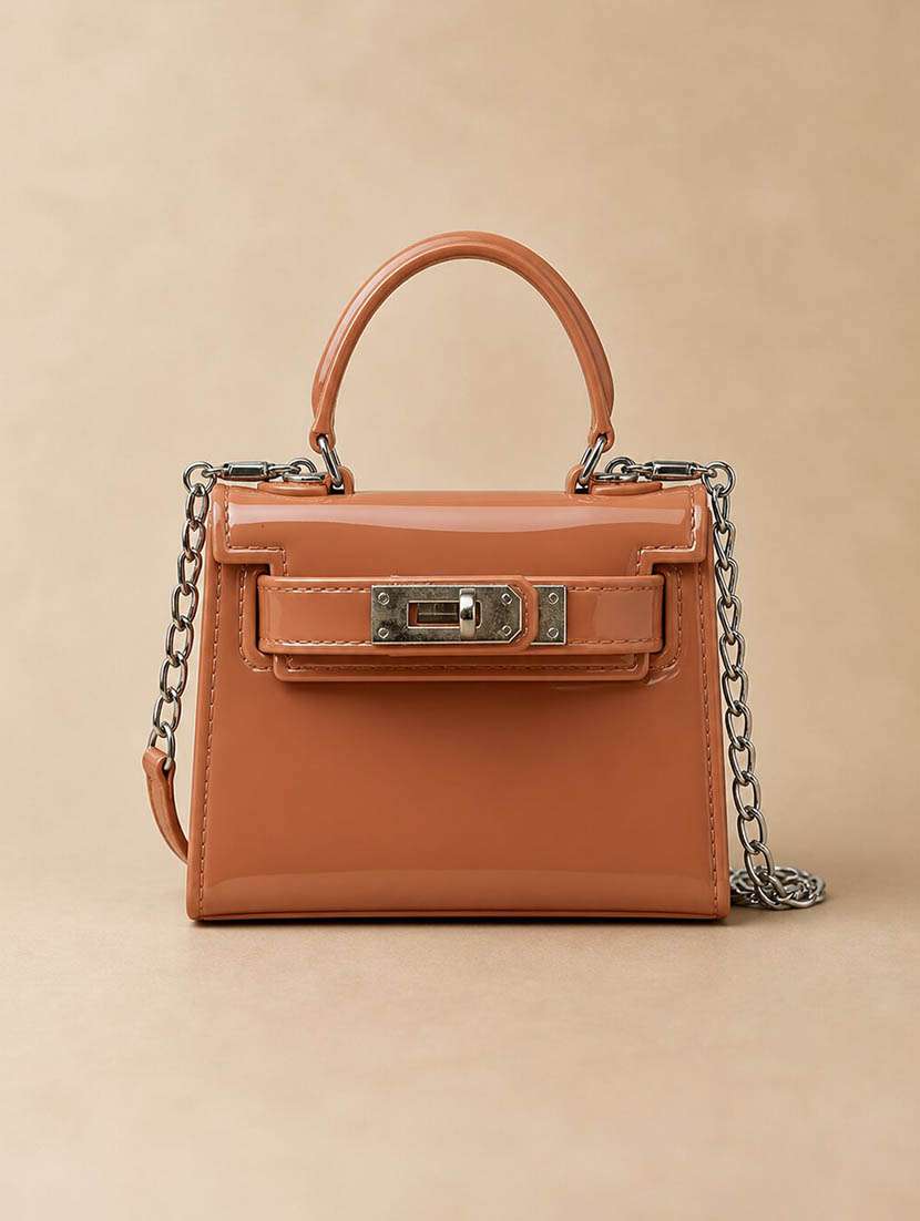 women solid twist clasp sling bag