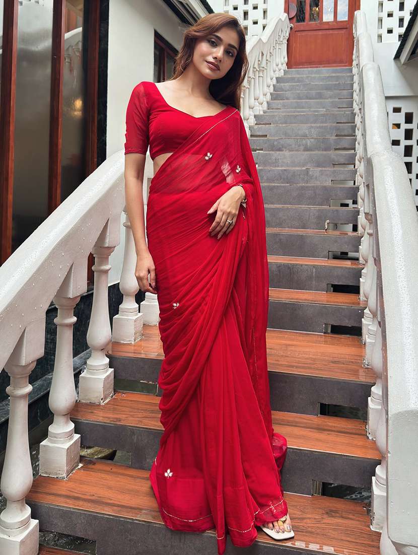 women solid with work embellished saree with blouse