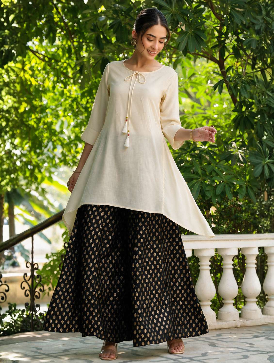 women solid three quarter sleeves asymmetric kurta