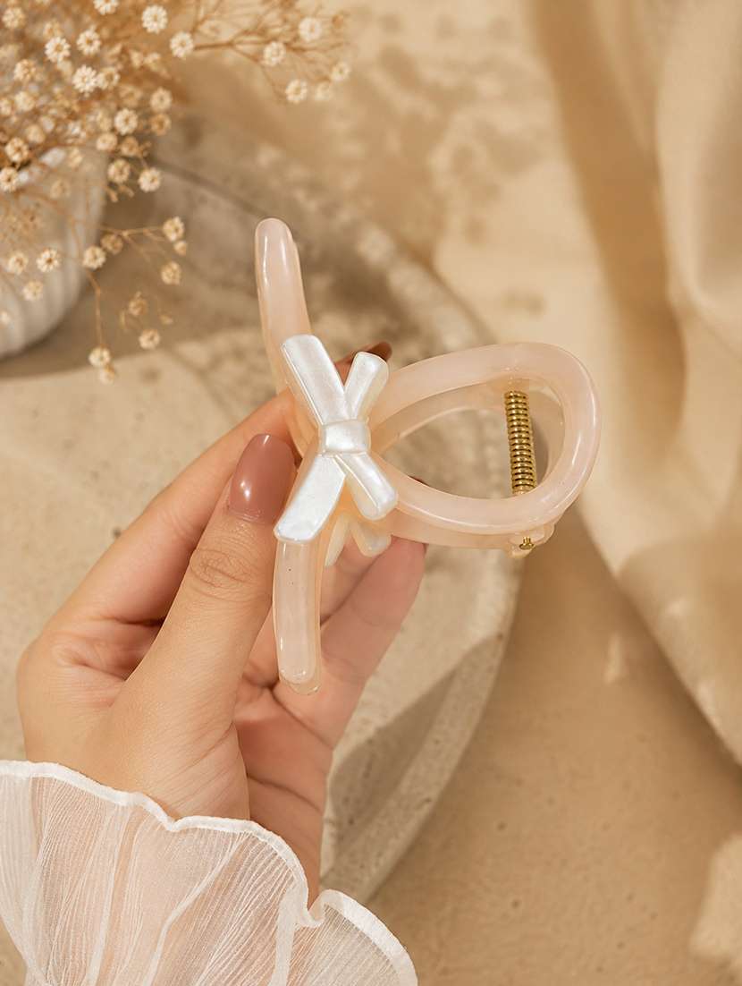 peach glossy bow design hair claw clip for women - 22639727 -  Standard Image - 2