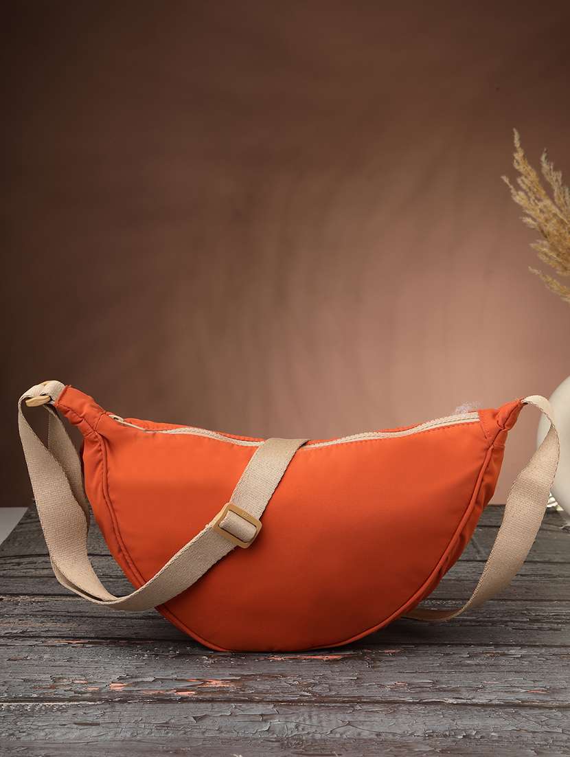 women solid sling bag with adjustable strap